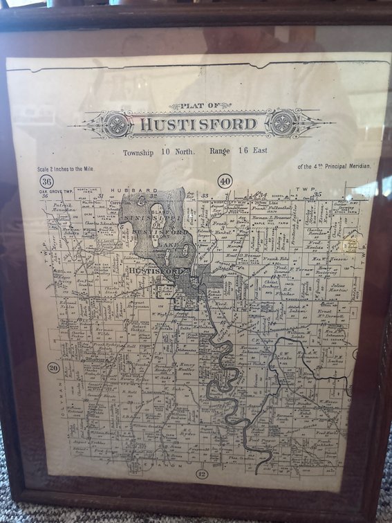 Framed plat map of historic Hustisford