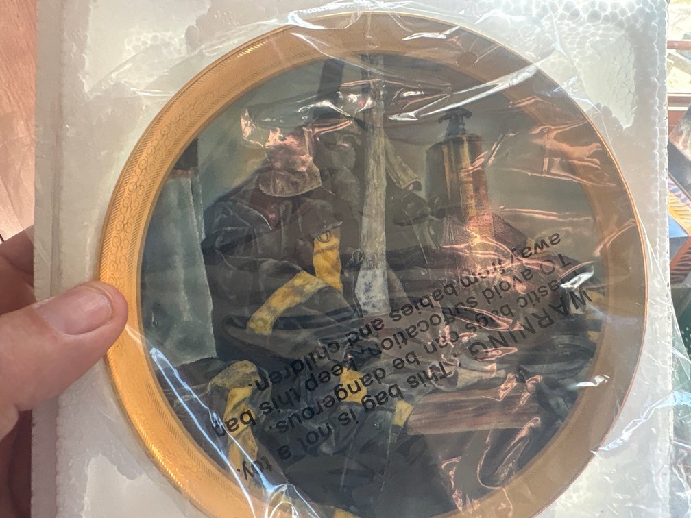 Decorative plates, firefighter and deer