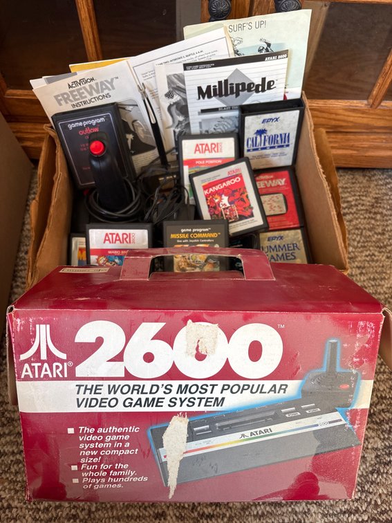 Atari 2600 w/ controllers, games and paperwork