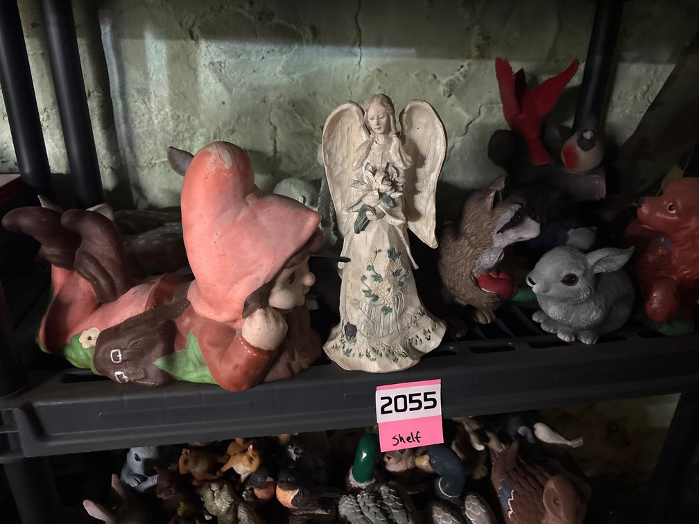 Shelf of outdoor yard figurines