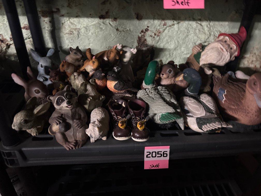 Shelf of outdoor figurines