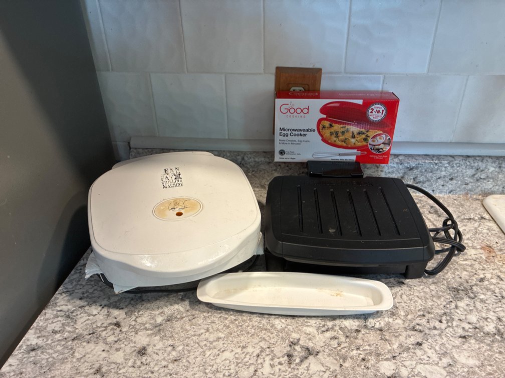 George Foreman Grilling Machines And An Egg Cooker