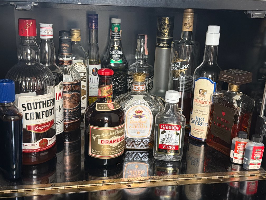 Assorted Liquor in Cabinet