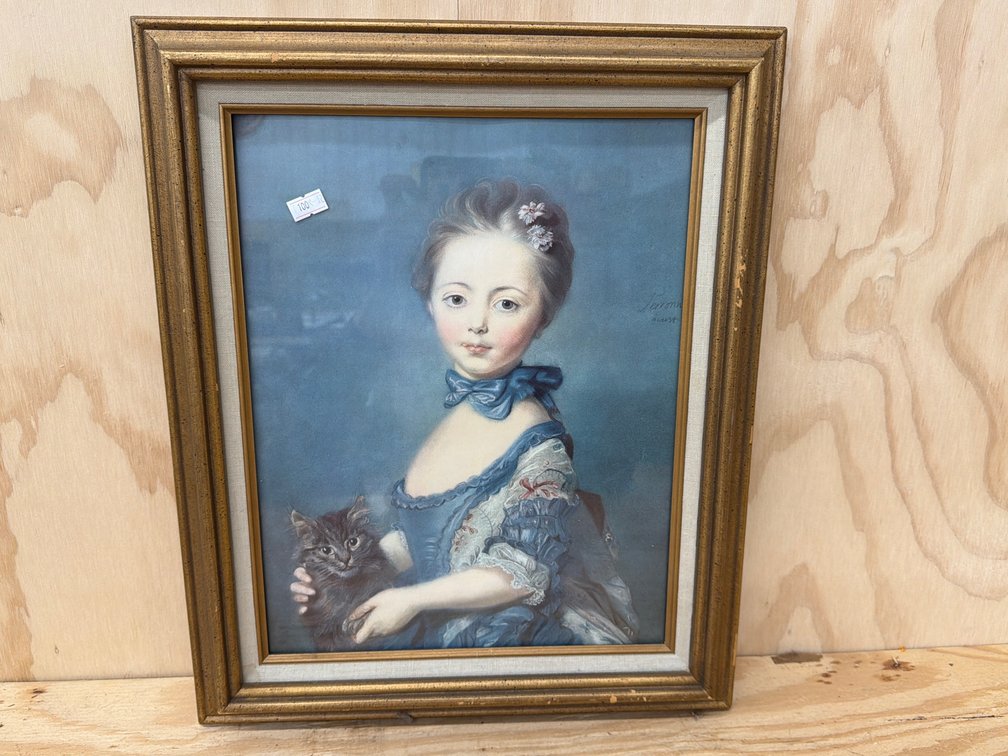A Girl With a Kitten Framed Print