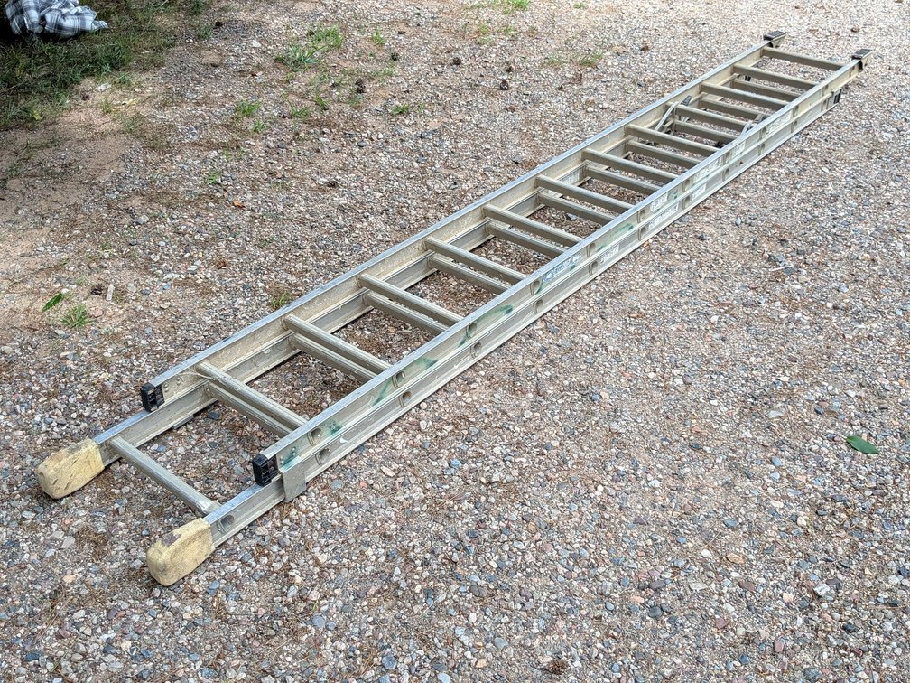 Werner 24ft type 1A aluminum extension ladder is straight.