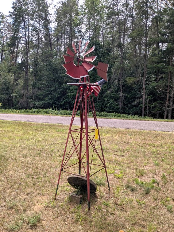 Nice windmill turns freely and is about 8' tall.