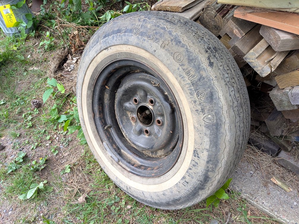 Trailer spare tire with good tread and minimal weather checking, has a  5x 4.75" bolt pattern.