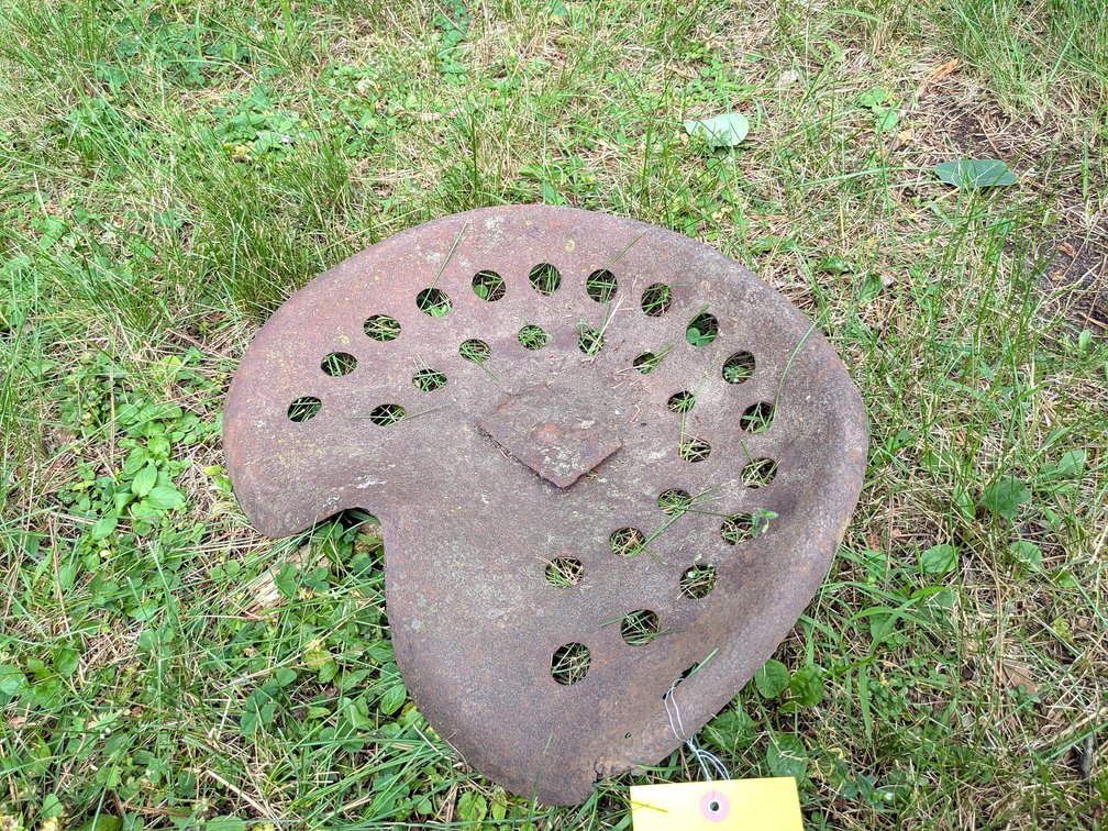 Cool old tractor seat is 17" wide.