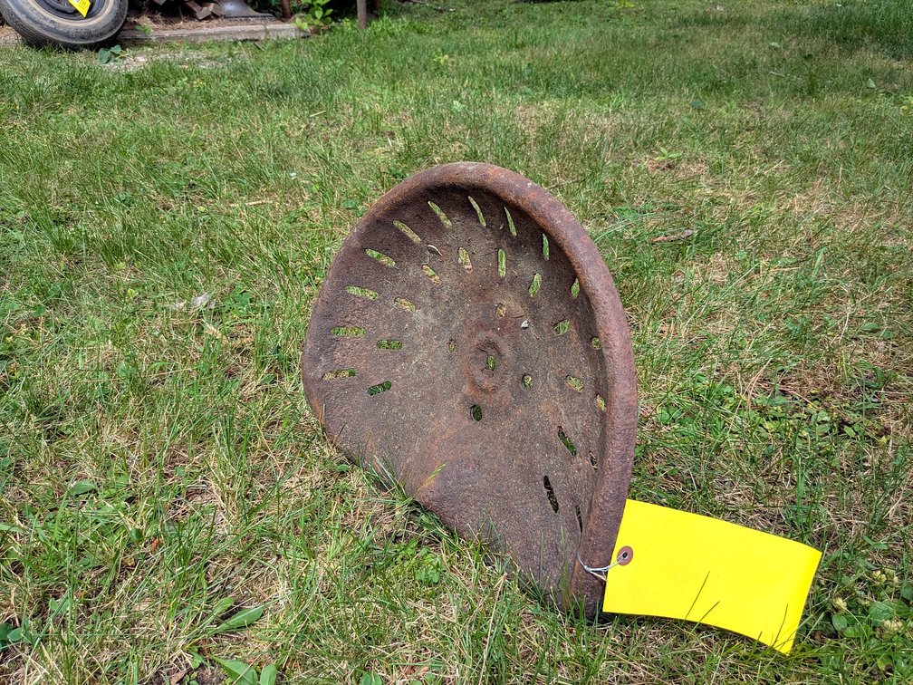 Antique tractor seat is approx 17" wide.