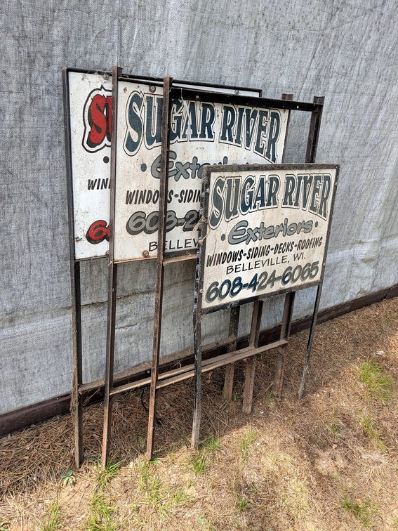 Four yard sign frames, three have sign boards.  Largest takes a sign 1-1/2' x 2' sign, up to 4' tall