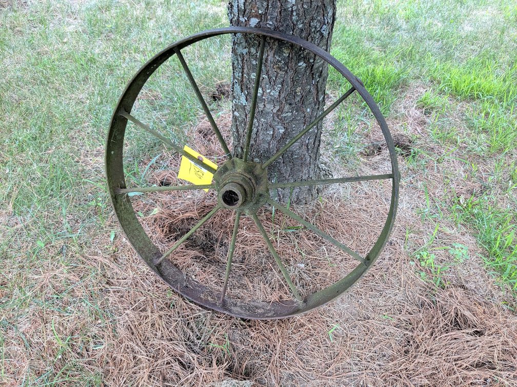 Old steel wheel measures approx 23" wide.