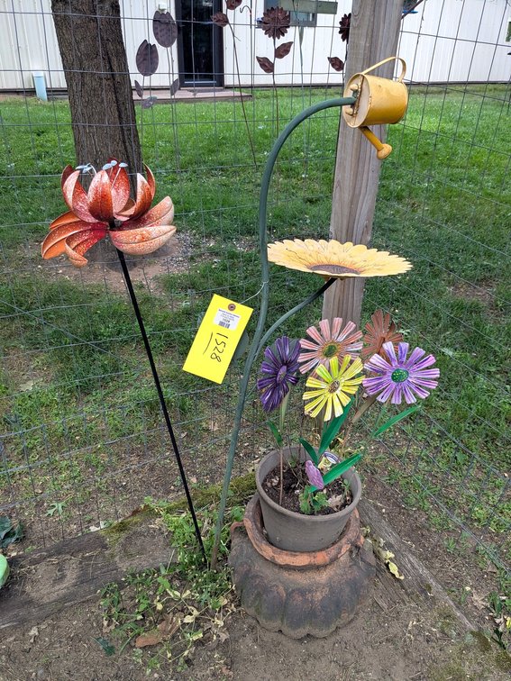 Cute flower garden stakes and a unique planter. Tallest piece approx 4-1/2'.