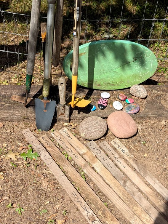 Gardening tools, kneeling mat, painted rocks, other rocks, more.