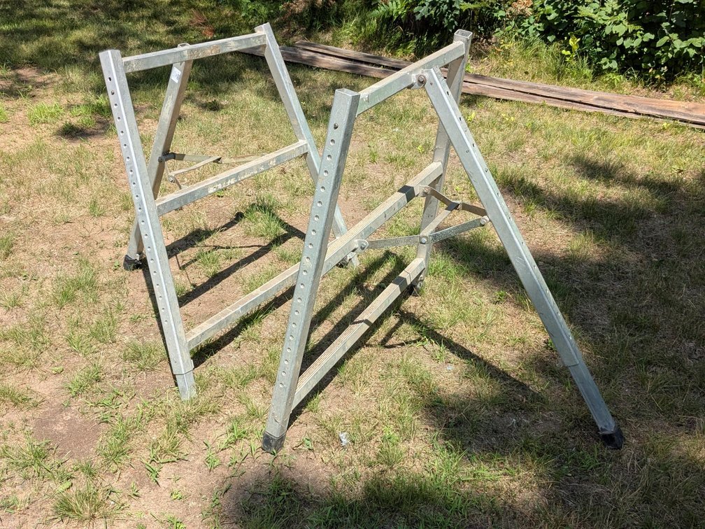 "Broncos" Aluminum scaffold or plank legs stand 40", but appear to extend up to 6'.  Great for roofi