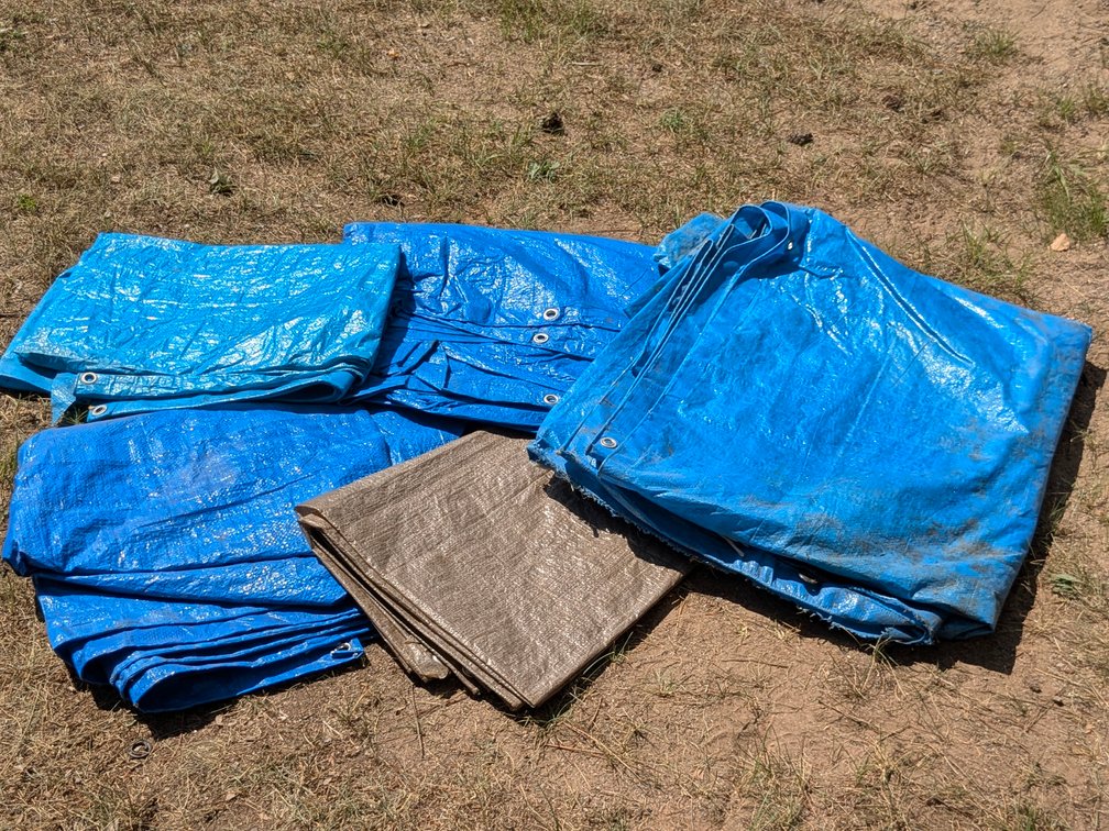 Several tarps neatly folded.