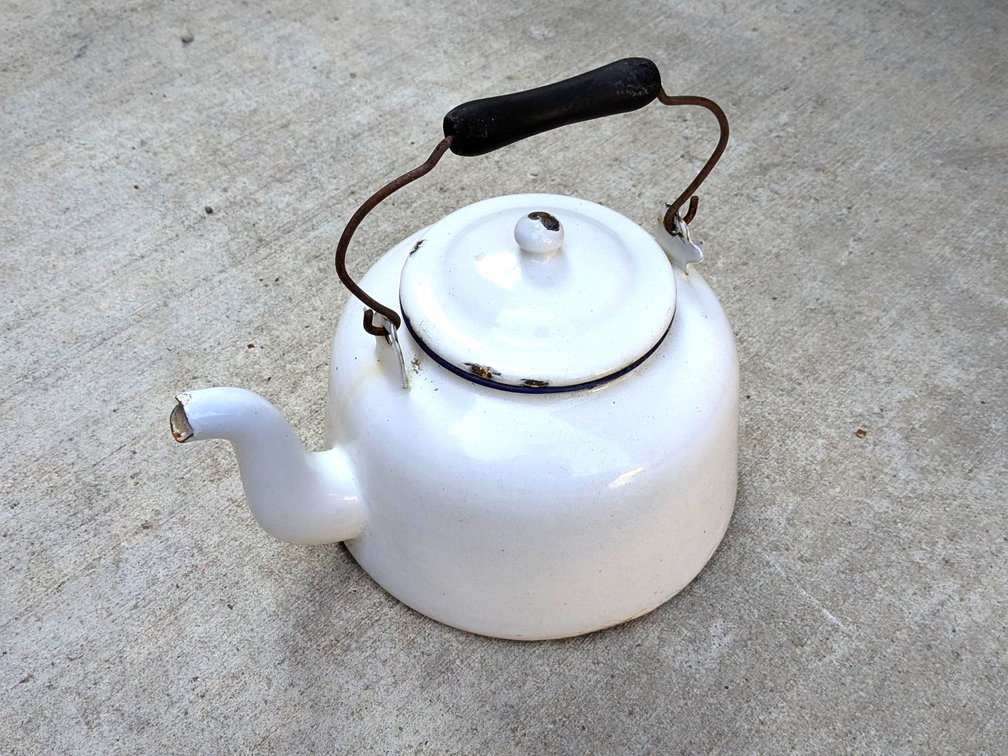 Very cute enameled teapot with original wooden handle, measures 11" long over spout