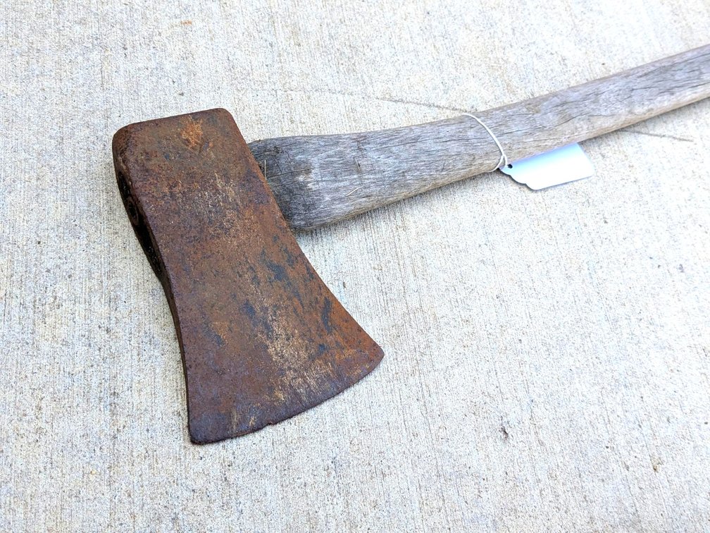 Single bit axe head has a 4-1/4" blade and is tight on the 27" handle. Markings noted, see pictures.