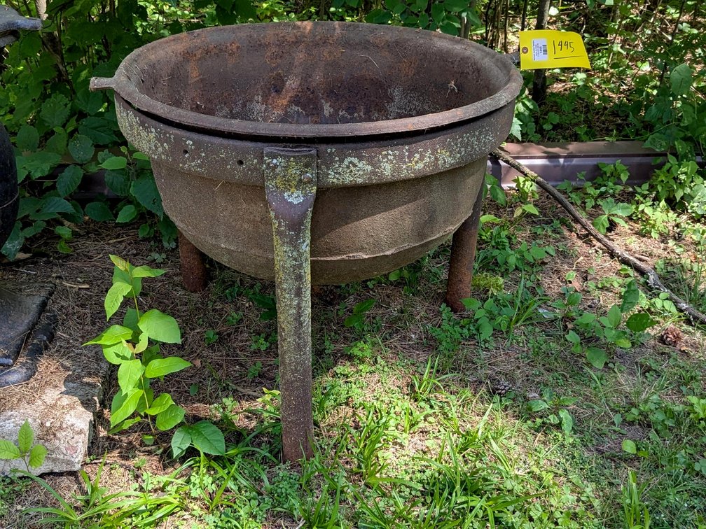 Very impressive cast iron cauldron with stand measures 32" wide over rim and  18" deep. Stands 27" o
