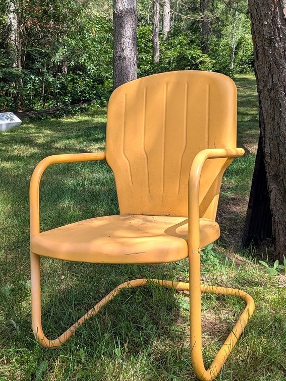 Sunny yellow stamped steel lawn chair measures 16" to seat.