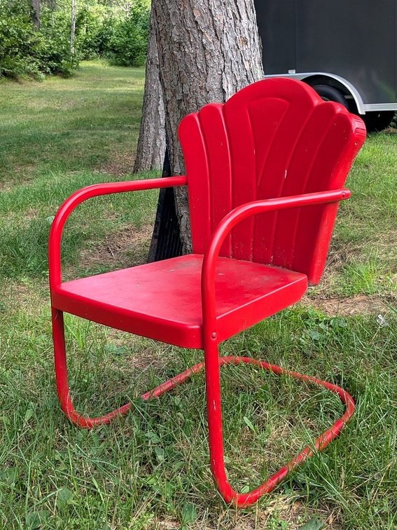 Cheery red stamped steel lawn chair measures 17" to seat.