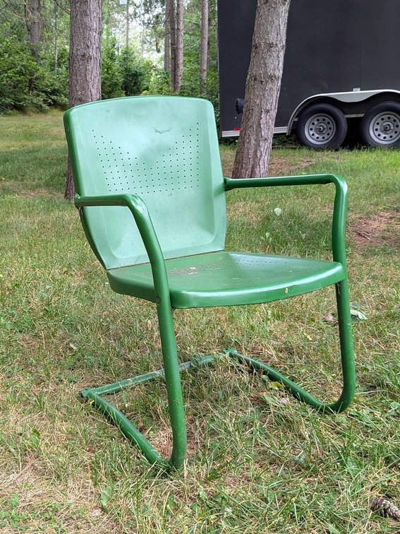 Classy green stamped steel lawn chair is 16" to seat.