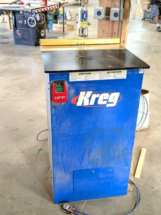 Kreg brand drilling table is Model DK1100 FE, has a 24" table and foot pedal control.