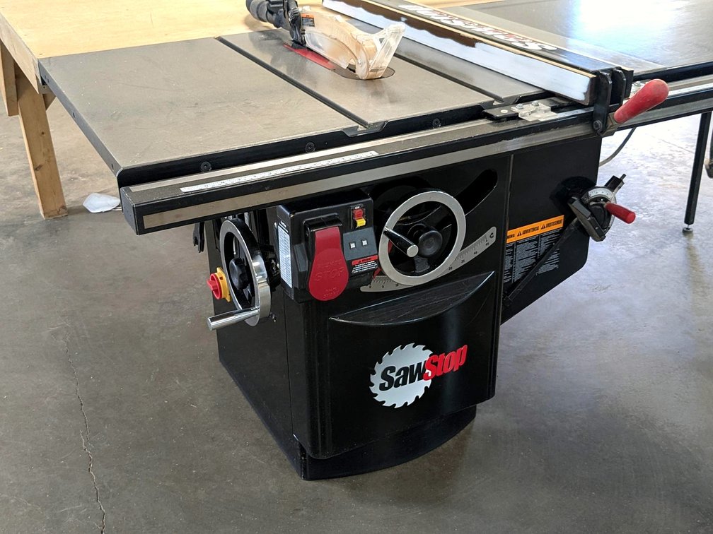 SawStop 10" industrial cabinet saw with a 230 volt single phase 3 hp motor; has a 7' table, 4' table
