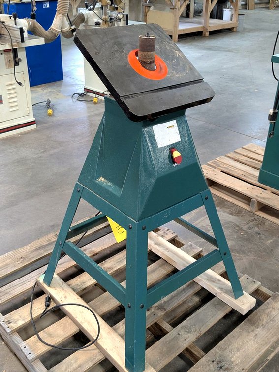 Grizzly oscillating drum sander with a 15" table and 2" drum.
