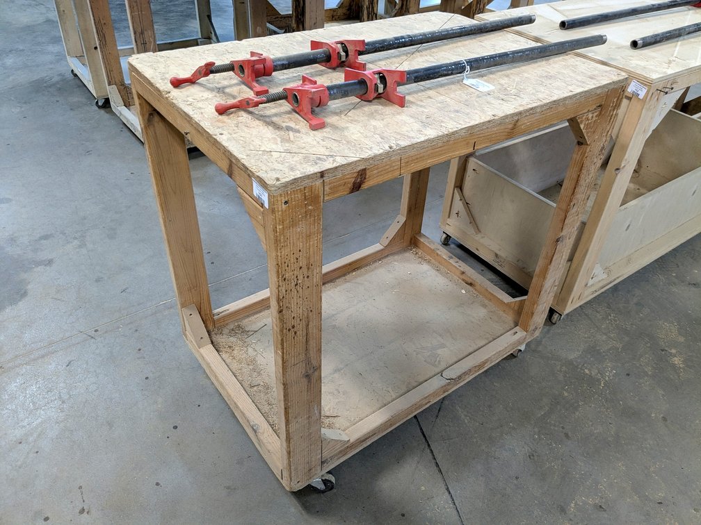 3' rolling work bench is about 2' x 3'.