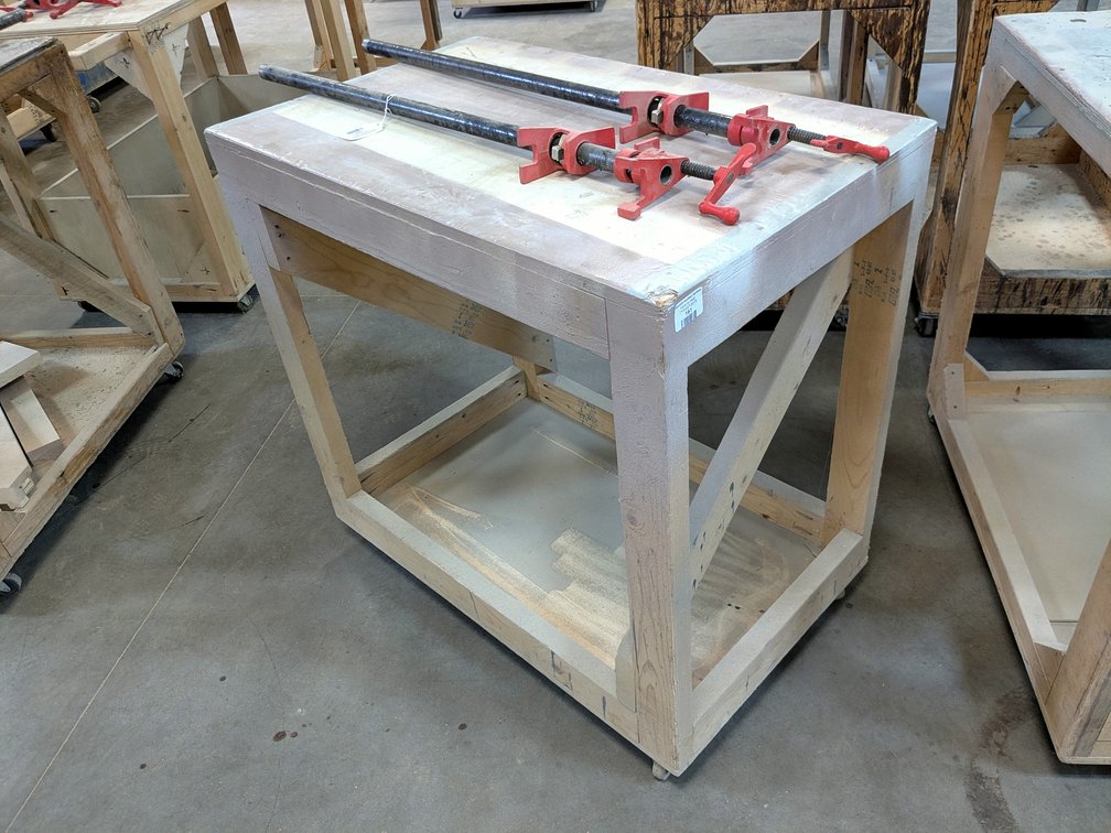 3' rolling work bench is about 2' x 3'.