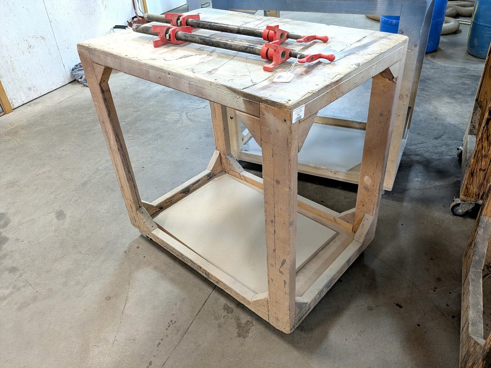 3' rolling work bench is about 2' x 3'.