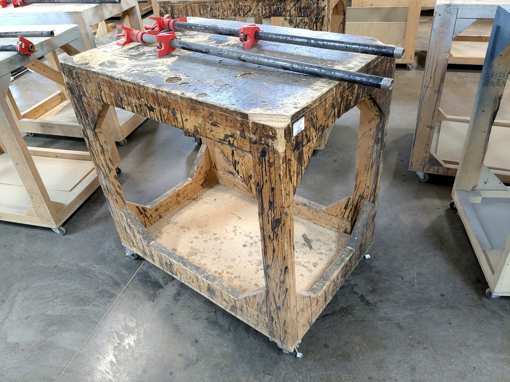 3' rolling work bench is about 2' x 3'.