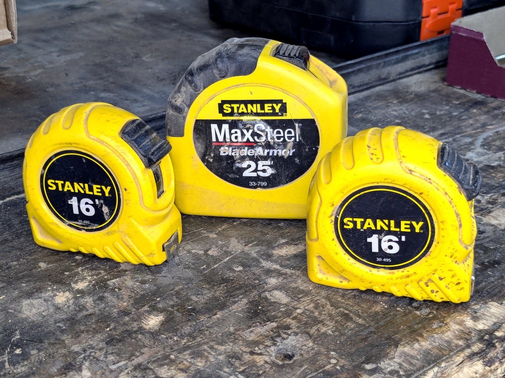 Three Stanley tape measures up to 25'.