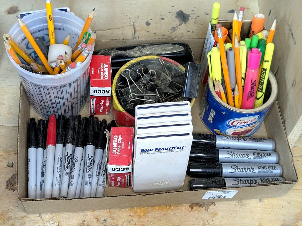 Office supplies including Sharpie markers, calculators, and more.