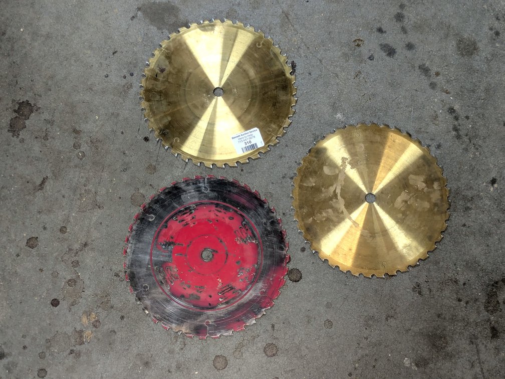 Three 10" circular saw blades with carbide tips.