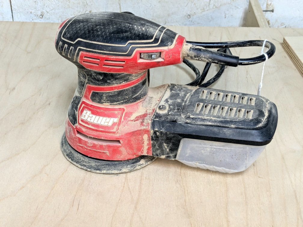 Bauer 5" palm sander with dust collector.