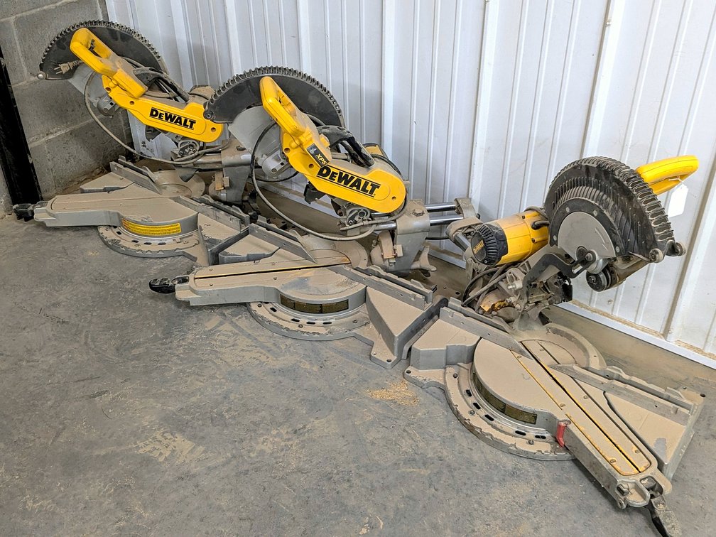 Three DeWalt sliding compound miter saws for parts or repair.