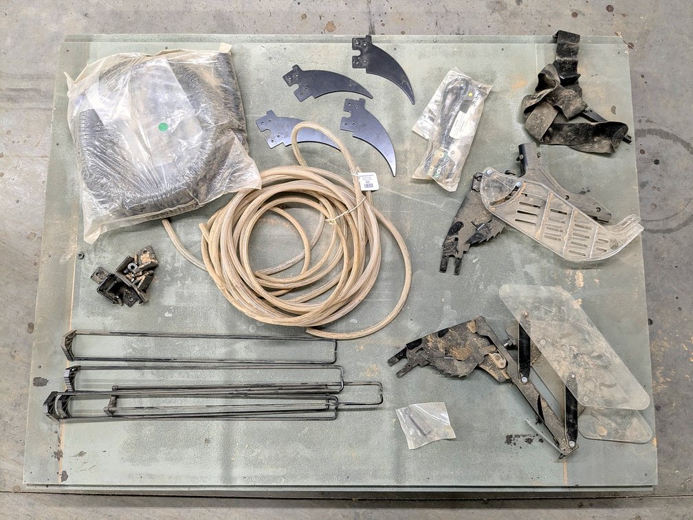 Table saw parts including blade guards, dust collectors and more.  Comes with a 54" rolling platform