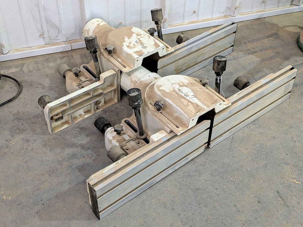 Jet brand tongue and groove guides with dust collector systems.