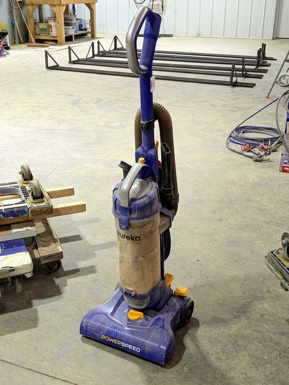 Eureka upright Power Speed vacuum cleaner with attachments.