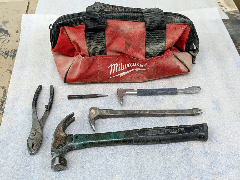 Milwaukee tool bag with Estwing and other pry bars, hammer and more.