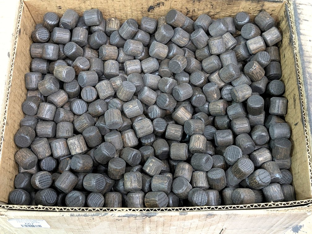 Dark stained wooden dowel plugs are each approx. 7/8" diameter.  Box is 15" wide.