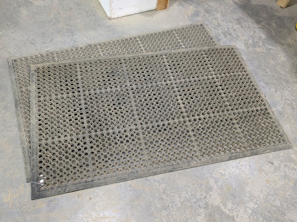 Two rubber floor or shop mats are each 5' wide.