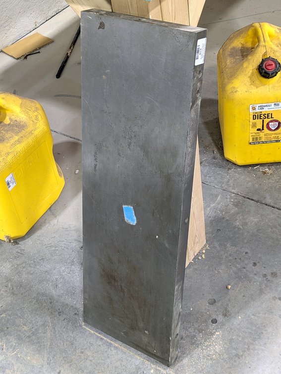 Precision ground steel table measures 10" x 30" and is 1-1/2" thick.
