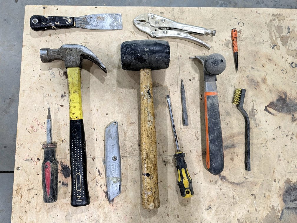 Paint scraper, hammers, pliers and more.