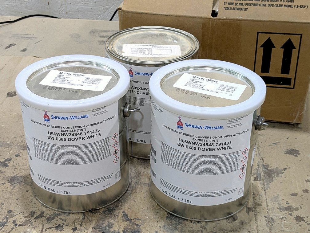 No shipping.  Sherwin Williams Dover White paint, three gallons feel full.