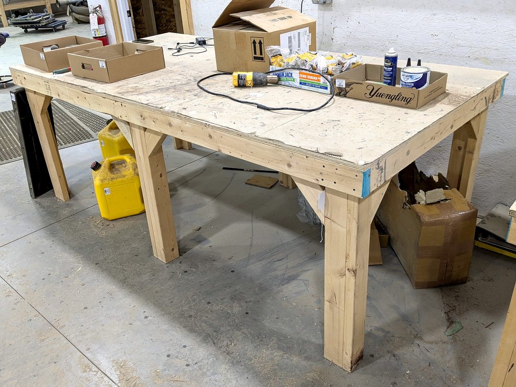 Sturdy 4' x 8' work bench is 35" high.
