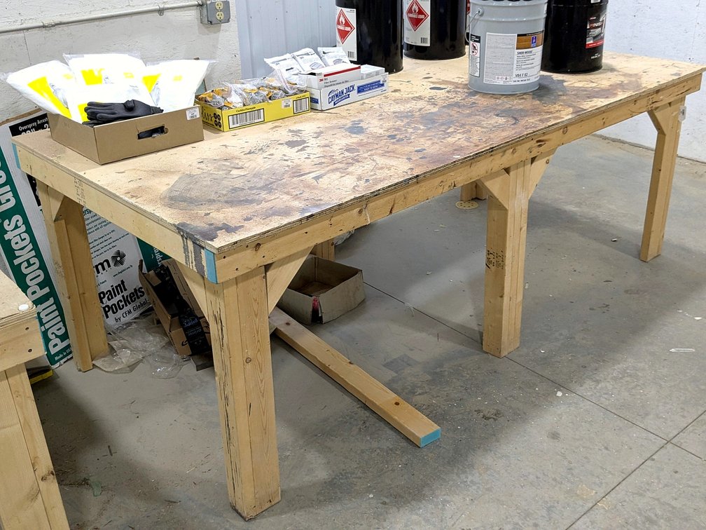 Sturdy 4' x 8' work bench is 35" high.