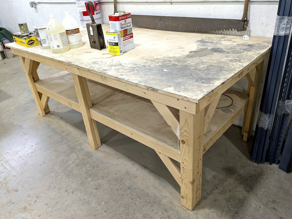Sturdy 4' x 8' work bench is 36" high.