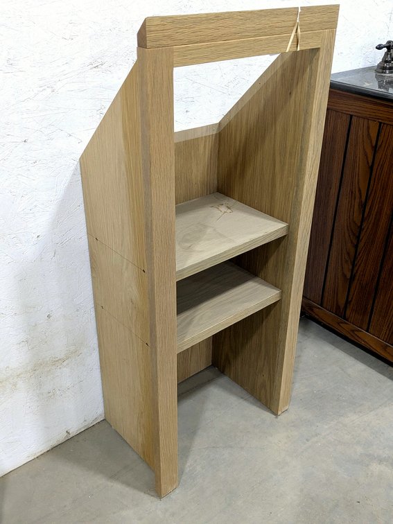 Custom under-stairwell shelf measures 18" wide x 12" deep x 42" tall at front.